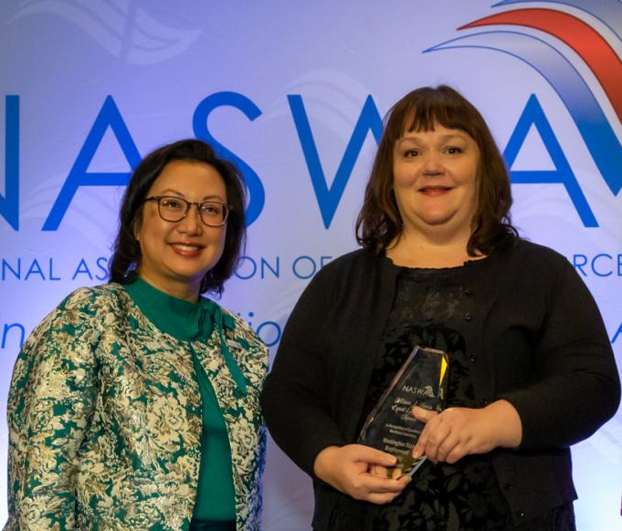 NASWA representative and Teresa Eckstein holding an award
